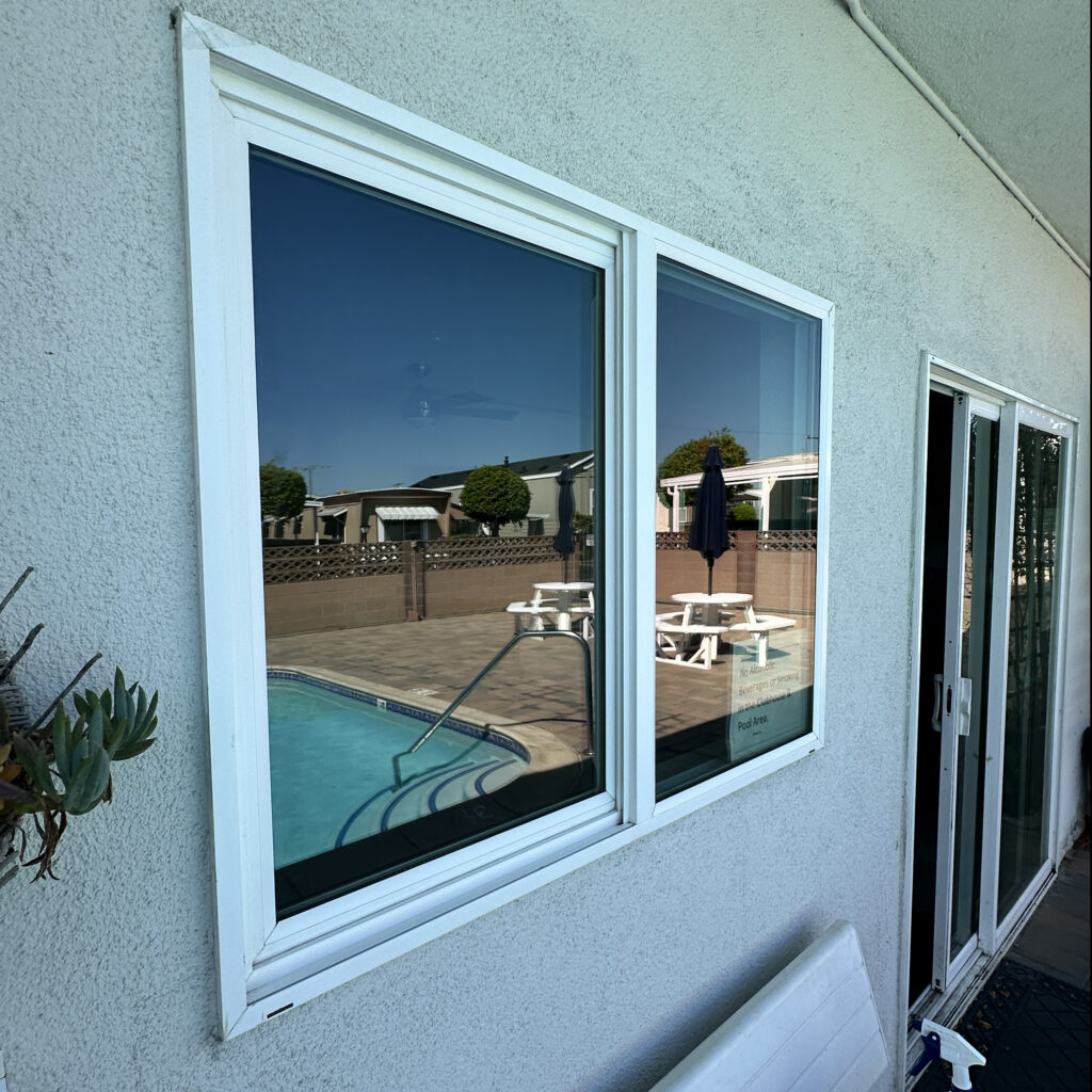 Clean Poolside Clubhouse Windows Clean clubhouse windows overlooking a swimming pool after professional window cleaning